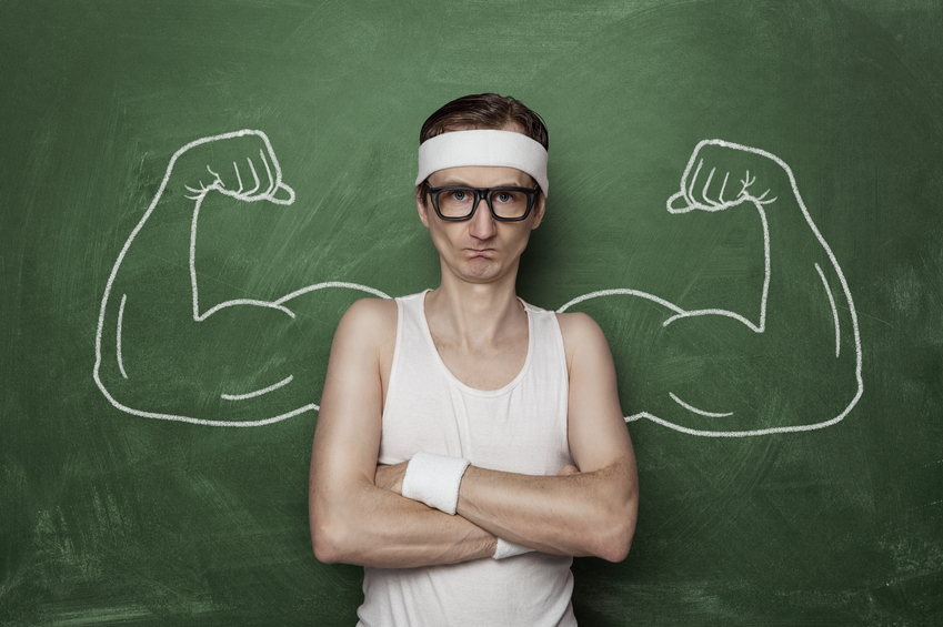 Funny sports nerd flexing fake muscle drawn on the chalkboard